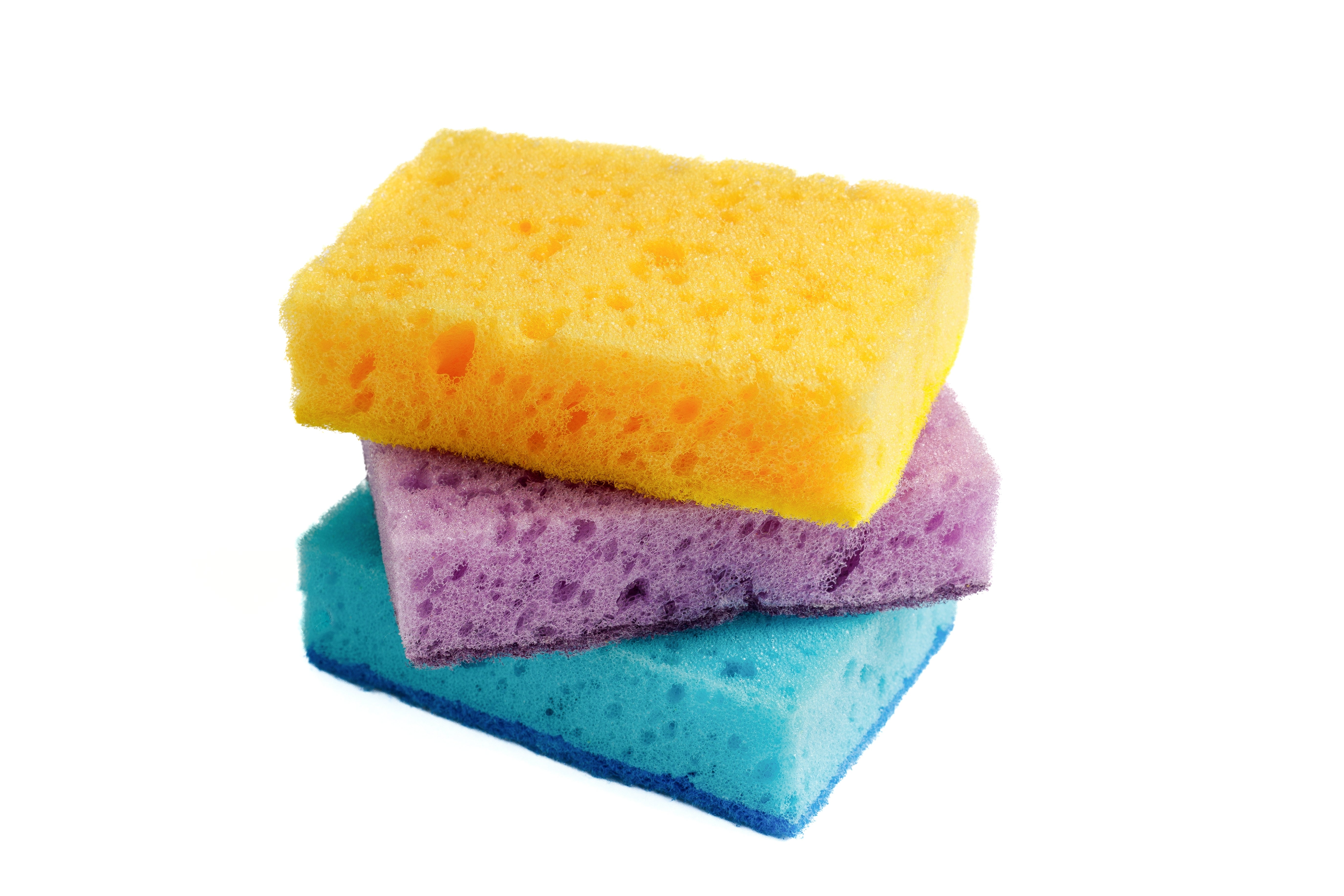 Three colorful sponges stacked on a white background